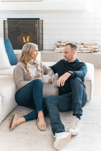 Man and woman sitting on the floor having a conversation