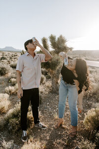 A couple drinks near a Joshua Tree at Mt Charleston.
