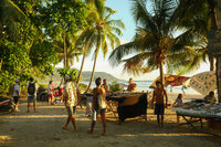 People gathering at market on the beach