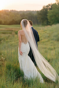Sunset photos of bride and groom on their wedding day at Saratoga National Golf Course