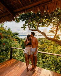 man and woman smiling with view