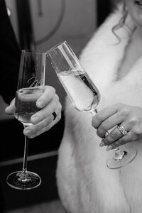 Bride and Groom with Champagne Flutes at The Tinsmith in Madison, Wisconsin | Cree La Vie Studios