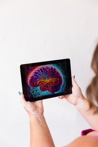 A picture of a neon bran on an iPad