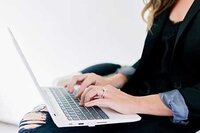 Red Velvet Collective - Jacksonville Business Event Planner Typing on Computer