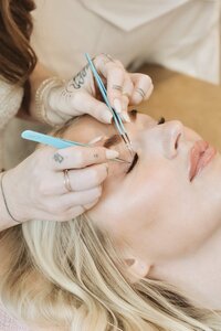 Lash specialist applying lash extensions in Austin