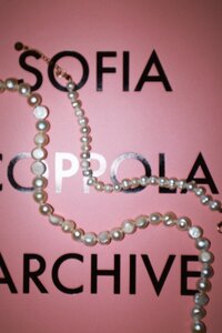 Artistic image of jewelry and book from Engagement videographer_ADP Studio