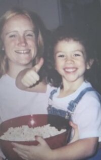 Childhood picture of Mariah with a bowl of popcorn