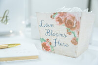 A box with text and flowers images