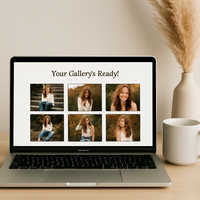 Minimalist desk scene with a MacBook displaying a photo gallery and a coffee mug beside pampas grass, representing image delivery after a portrait session.