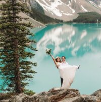 Utah Wedding Photographers capture groom lifting bride during mountain bridal portraits