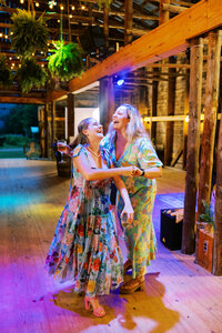 Wedding guests enjoying the dancing at reception at Paint Rock Farm, by photographer My Sun and Stars Co.