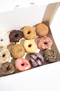 Tilted Box of Assorted Donuts - Daylight Donuts