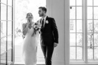 happy laughing couple underneath veil at nashville outdoor wedding at grandale manor wedding venue