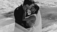 black and white image bride on beach