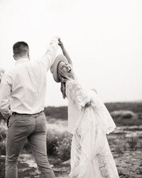Bride and groom dancing and laughing