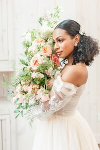 Bride holding lush pink bouquet