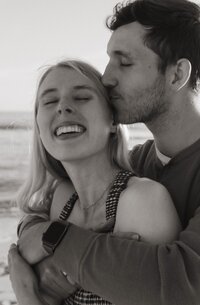 couple kissing on forehead