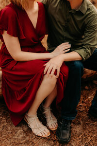 Couples session near Dayton TX - close-up detail of couple sitting together holding hands