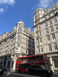 Photo of Red Bus and European Buildings