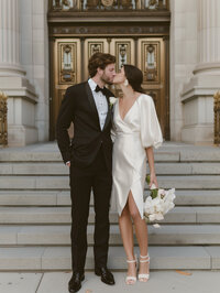 Bride and groom kissing