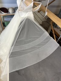 a wrinkled bridal gown layer after steam and press services
