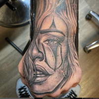 Realistic portrait tattoo on the hand inked at The Dark Art Collective Tattoo Studio, Tacoma, WA