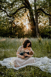 Beautiful couple kissing their puppy  in backyard session with Lux Marina Photography