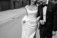 Wedding couple smiling and walking in Halifax
