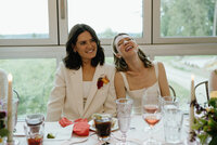 two brides laughing