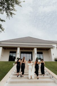 bridal party walks up stairs