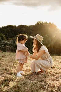 A mother holding her child during a family photoshoot