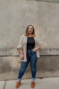 woman posing by wall