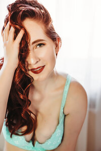 Romantic boudoir session with soft pastel colors in a Minneapolis setting