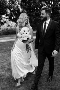 Couple walks together after their first look at their Montana wedding