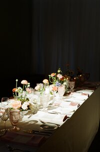 A table setting with wedding bouquet displayed on the table for an intimate wedding.