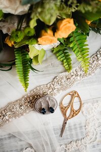 elegant weddign jewelry with bridal bouquet
