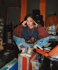 Woman sitting on the floor in a vintage shop