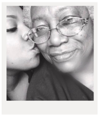 polaroid of a young black woman kissing her grandma
