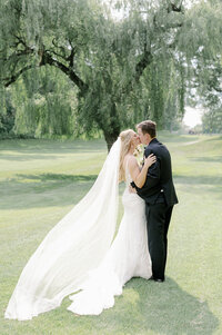 bride and groom posing for newlywed portraits