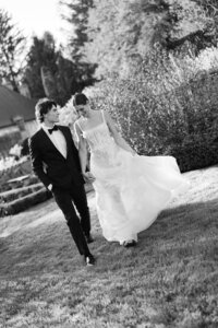 wedding couple walking in a field