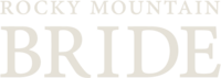 A white version of the logo for the company 'Rocky Mountain Bride'.