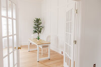 a room staged as a neutral home office for brand photography
