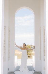 bride stands in archway