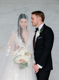 Bride and groom walk up memorial steps at their DC wedding