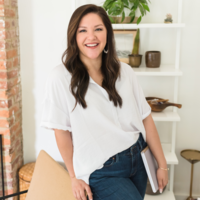 Virtual assistant client wearing blue shirt sitting on steps
