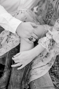 Couple cuddling  with his hand on her leg