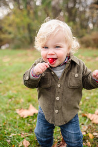 riverton new jersey family photographer kids photography little boy eating a red lollipop