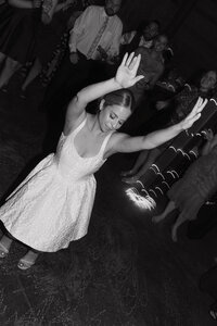 bride waving hands in the air