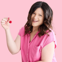 Emily Lauren Dick, brand strategist and website designer for women, wearing a black shirt with lips that say "bootstrapped woman."