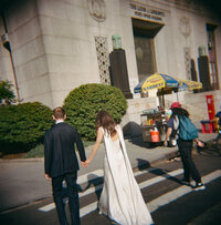 Timeless film photography of a couple at Manhattan City Hall. Discover editorial and documentary New York City wedding and elopement photography.